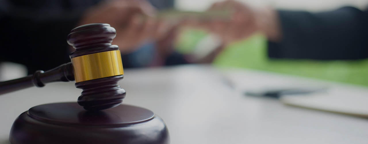 The concept of bribery of lawyers and judges.