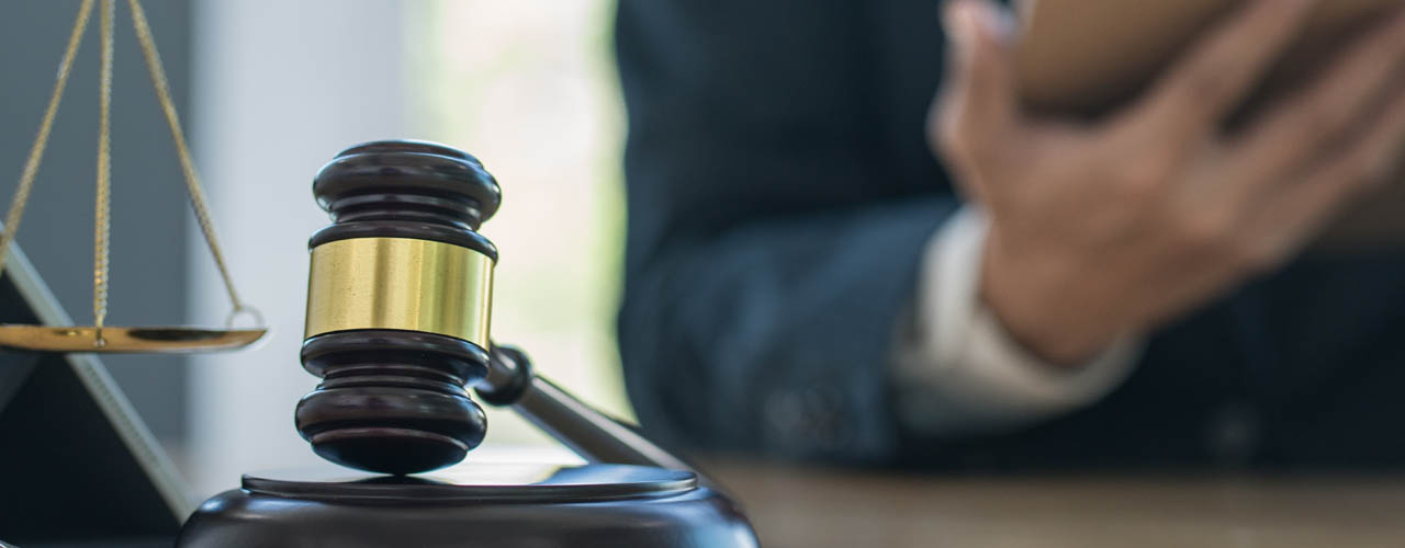 Justice and law concept.Male judge in a courtroom with the gavel