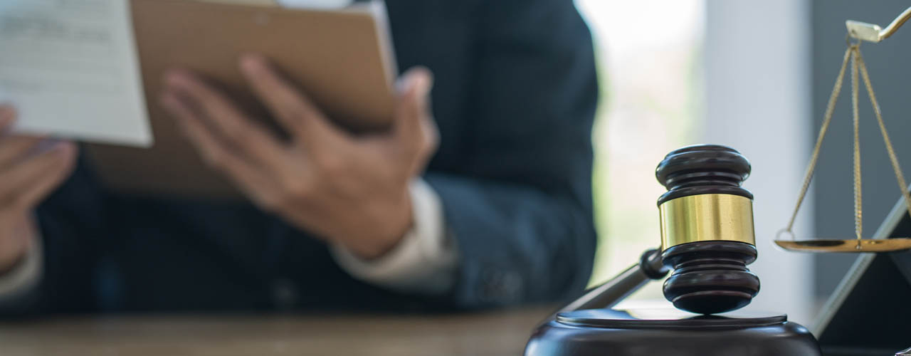Justice and law concept.Male judge in a courtroom with the gavel