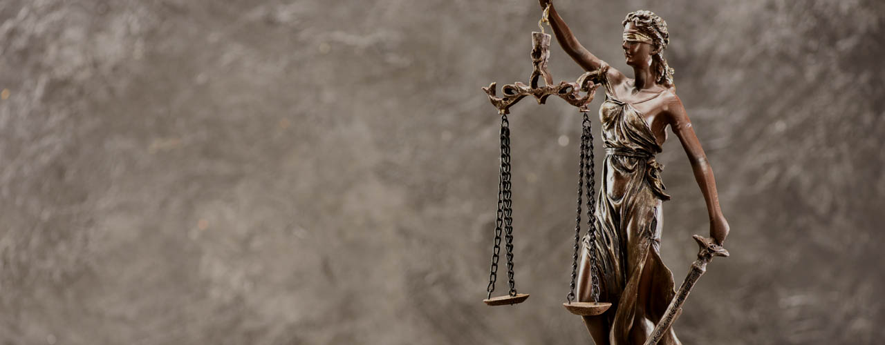 Close-up view of antique statue of lady justice, Law concept