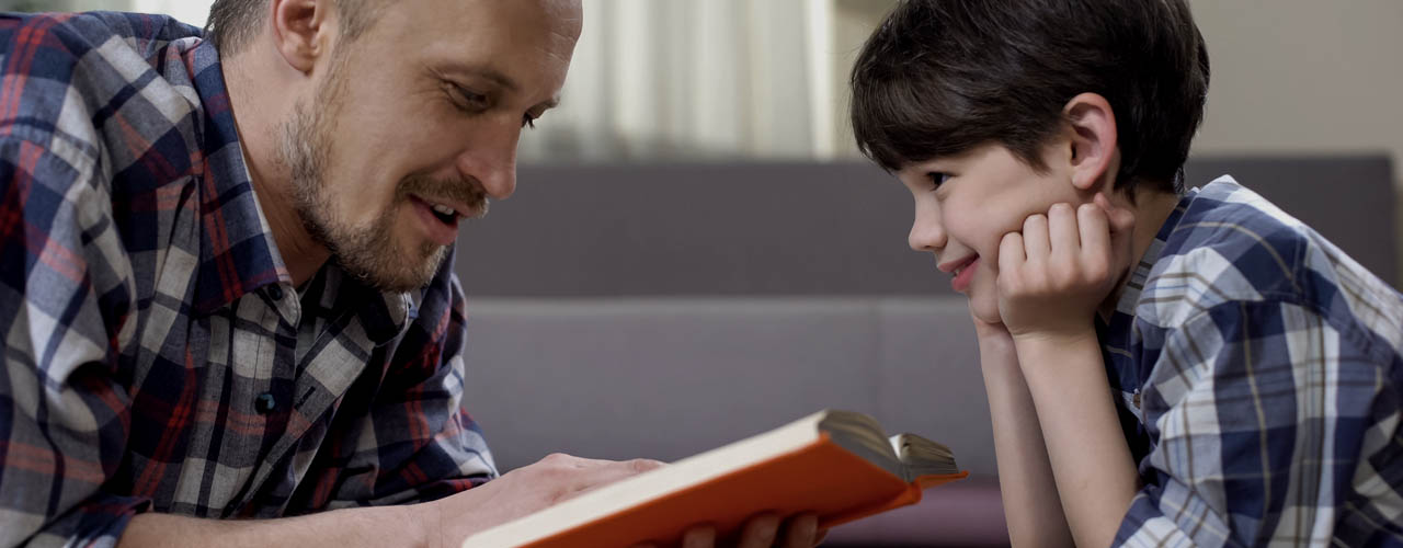 Father Reading Preschool Child Interesting Story Book, Spending